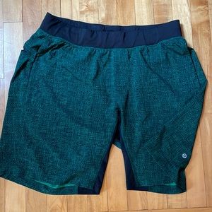Lululemon Men’s XL 9” inseam. Green and black “woven” print with back zip pocket